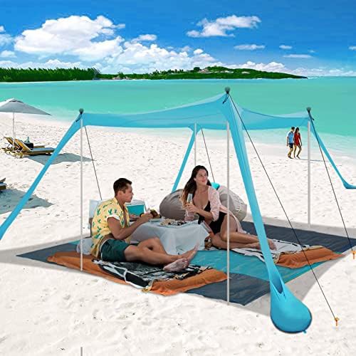 Beach canopy with integrated beach blanket